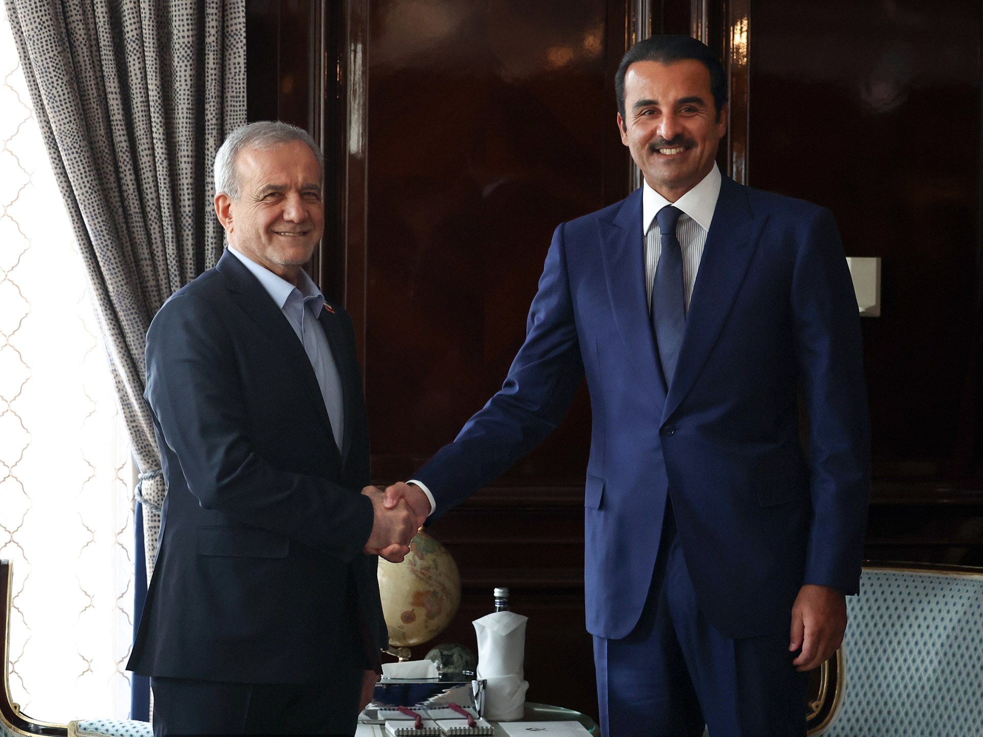 Qatar's Emir holds talks with Iran's president in Moscow
