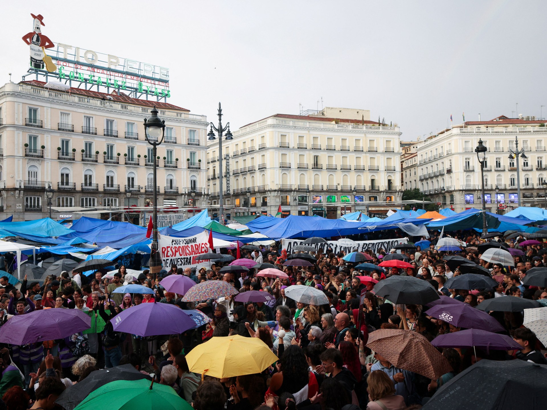 Madrid housing protesters establish tent camps in city center