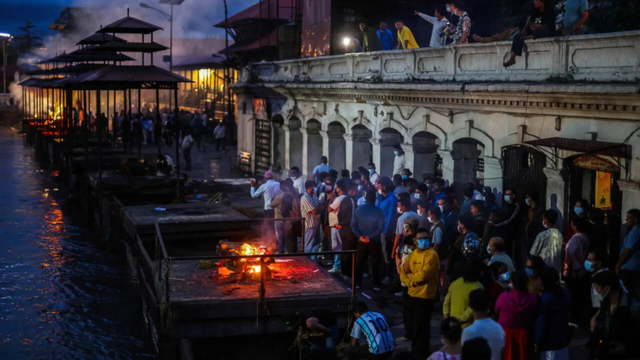 Nepal flood victims mourned through symbolic cremations as search efforts stall
