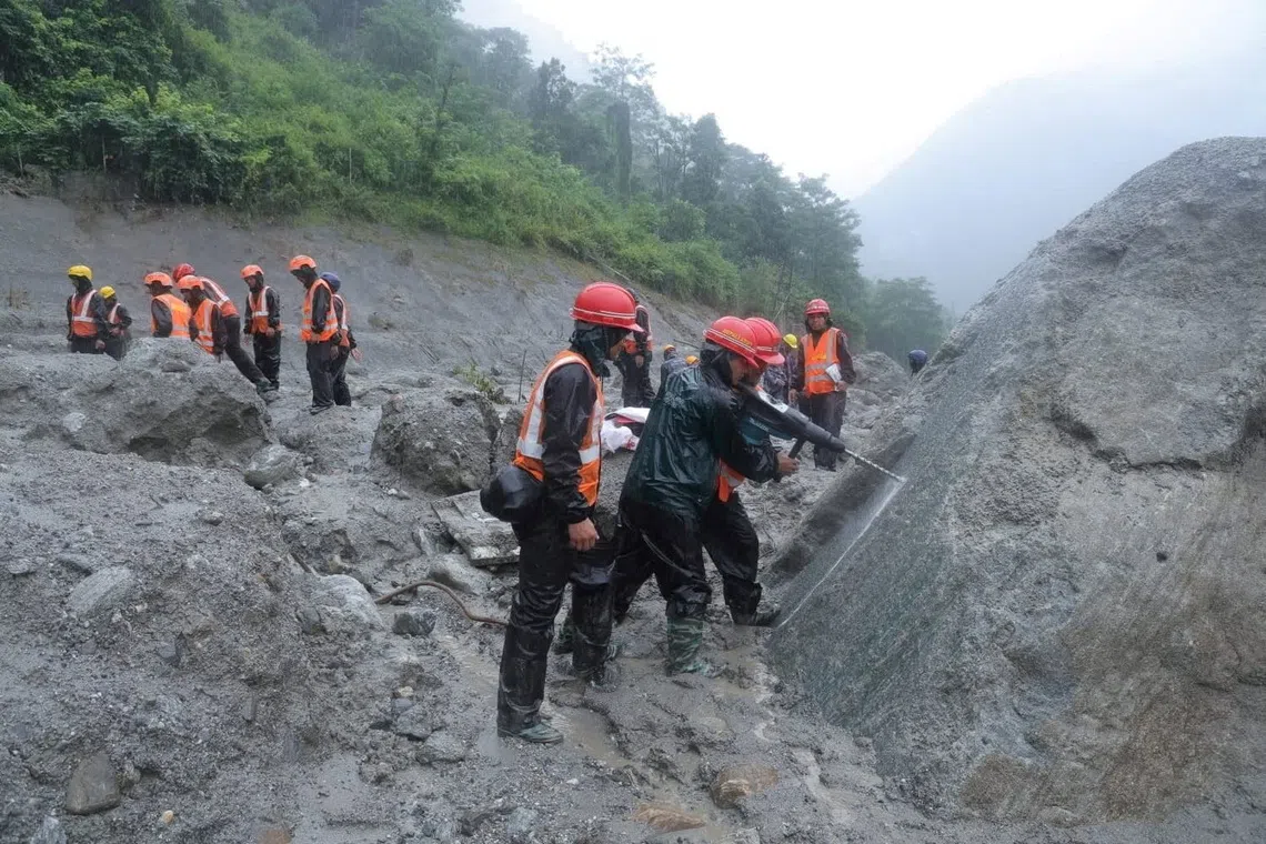 Nepal deploys heavy machinery in race to rescue tunnel-trapped workers