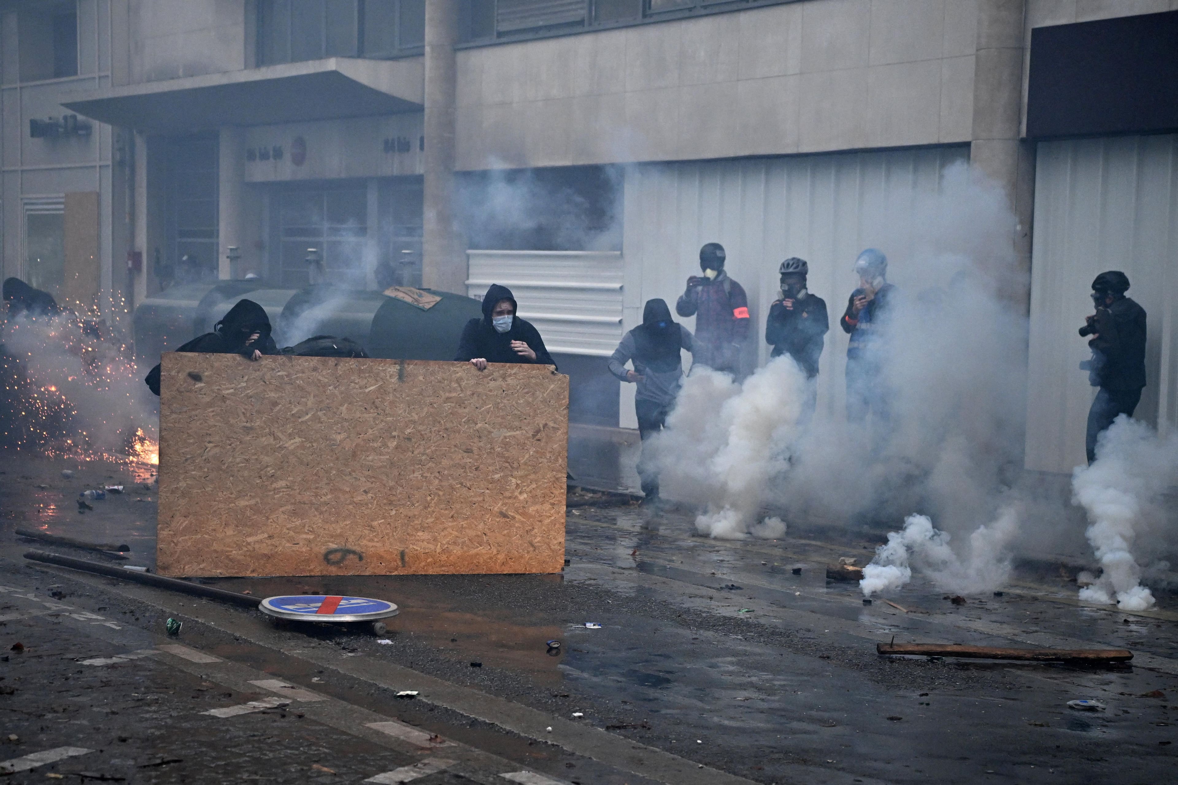 French police deploy tear gas as over 100,000 protest Macron policies