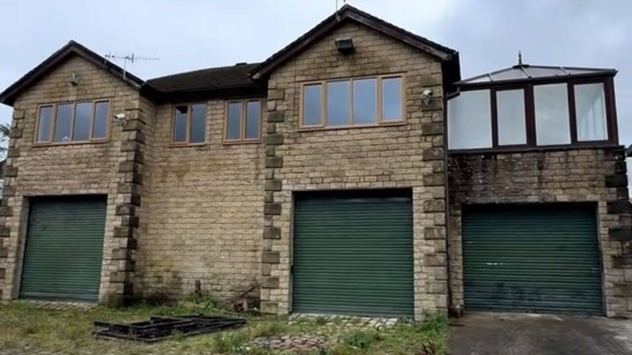 British couple converts defunct car dealership into luxury five-bedroom residence