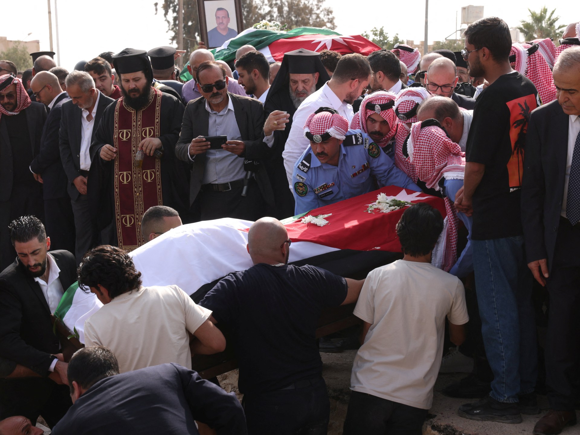 Jordan mourns church shooting victims as manhunt continues