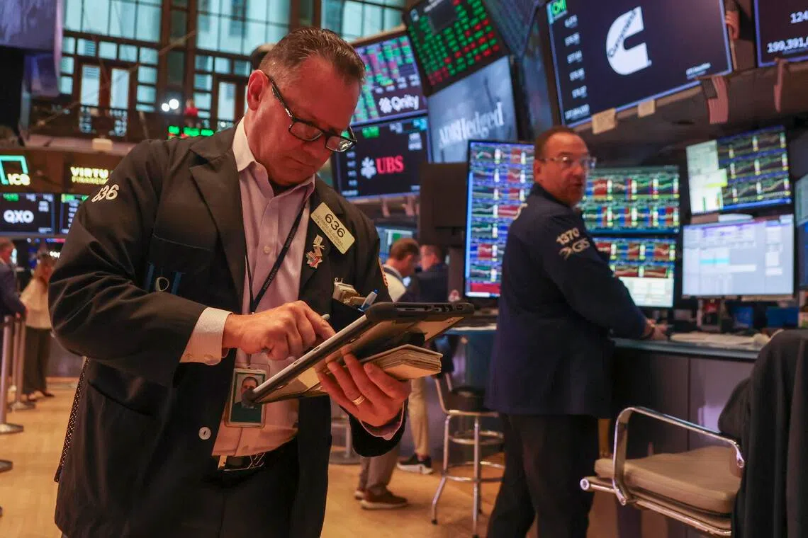 Wall Street tumbles as crude surges despite monthly gains