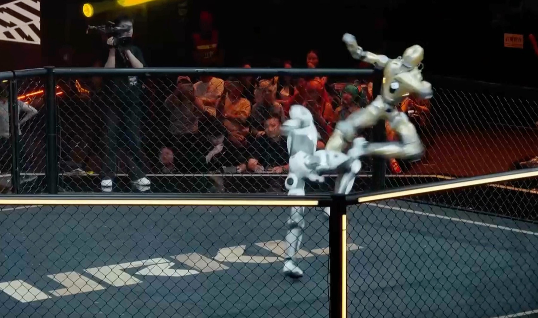 Humanoid robots compete in choreographed cage match demonstration in Shanghai