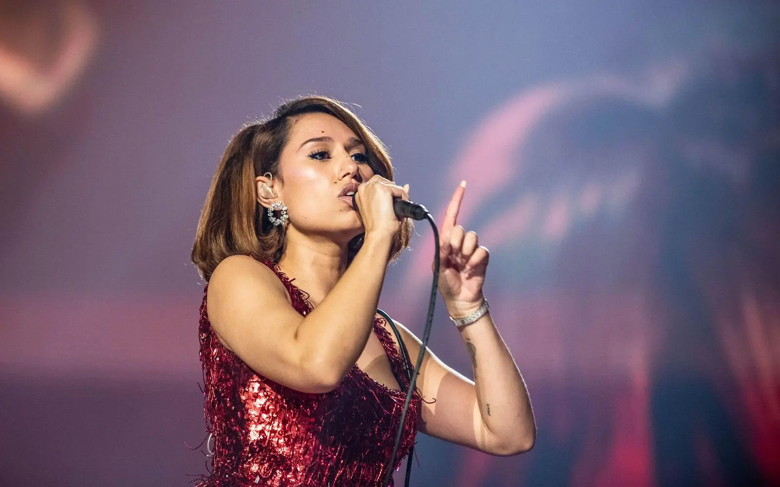 British singer-songwriter Raye claims Mercury Prize for latest album