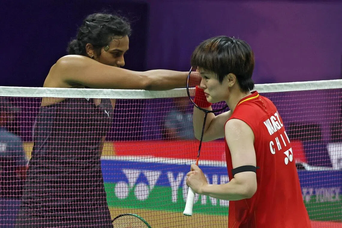 Wang edges past Sindhu in thrilling badminton worlds final