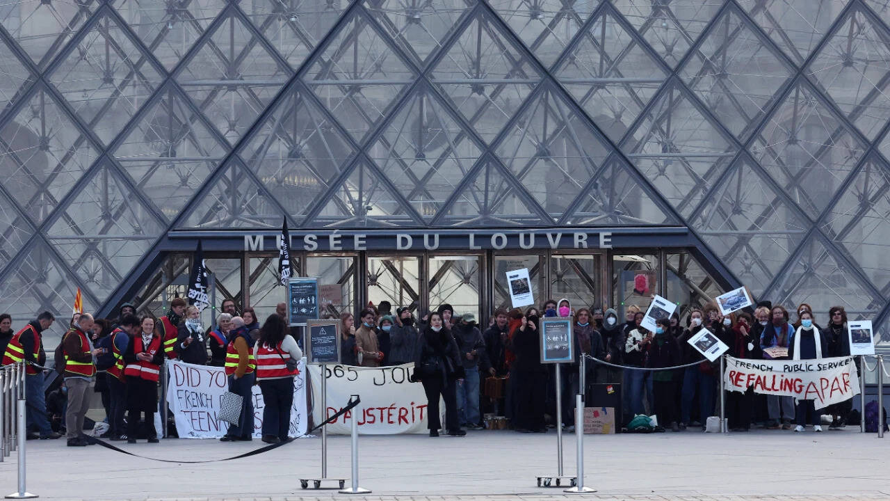 Paris Louvre shuts amid protests, one year after $102m heist