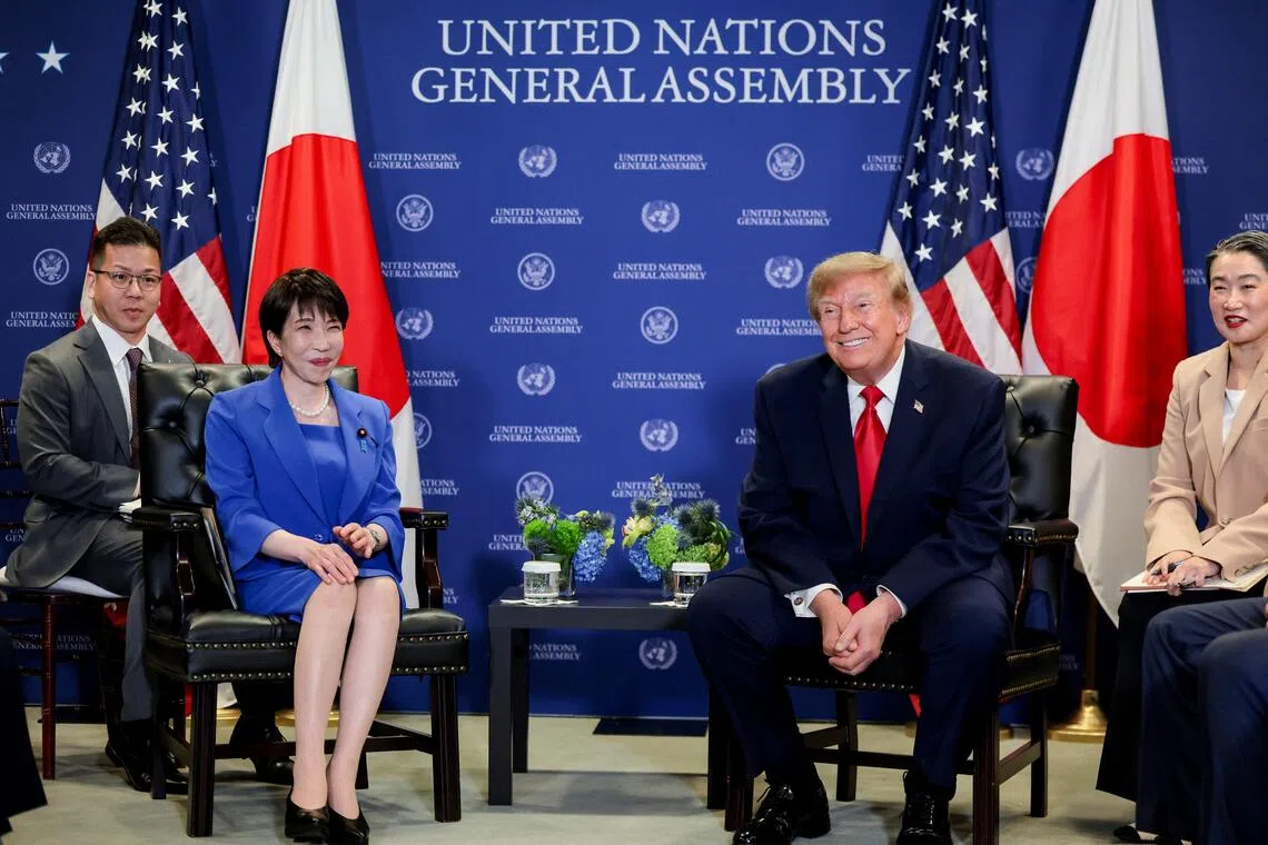 Trump raises currency concerns with Japan's new PM in bilateral talks
