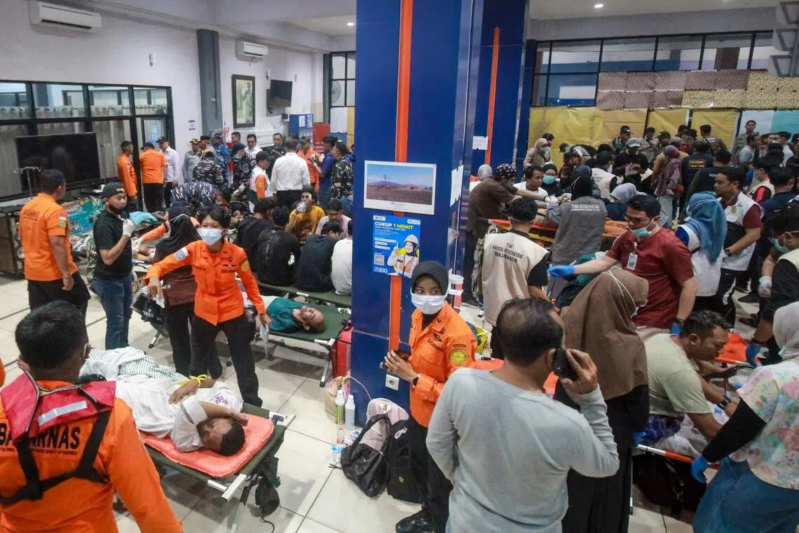 Storm delays search for 129 missing after Indonesian ferry capsizes