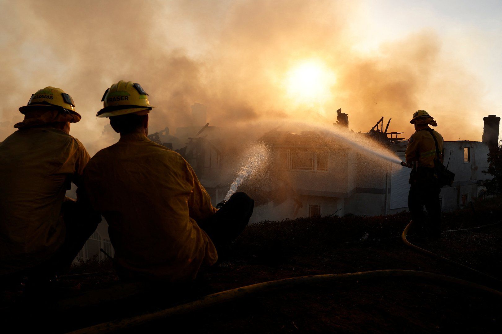 Thousands evacuated as fast-moving wildfires sweep Orange County