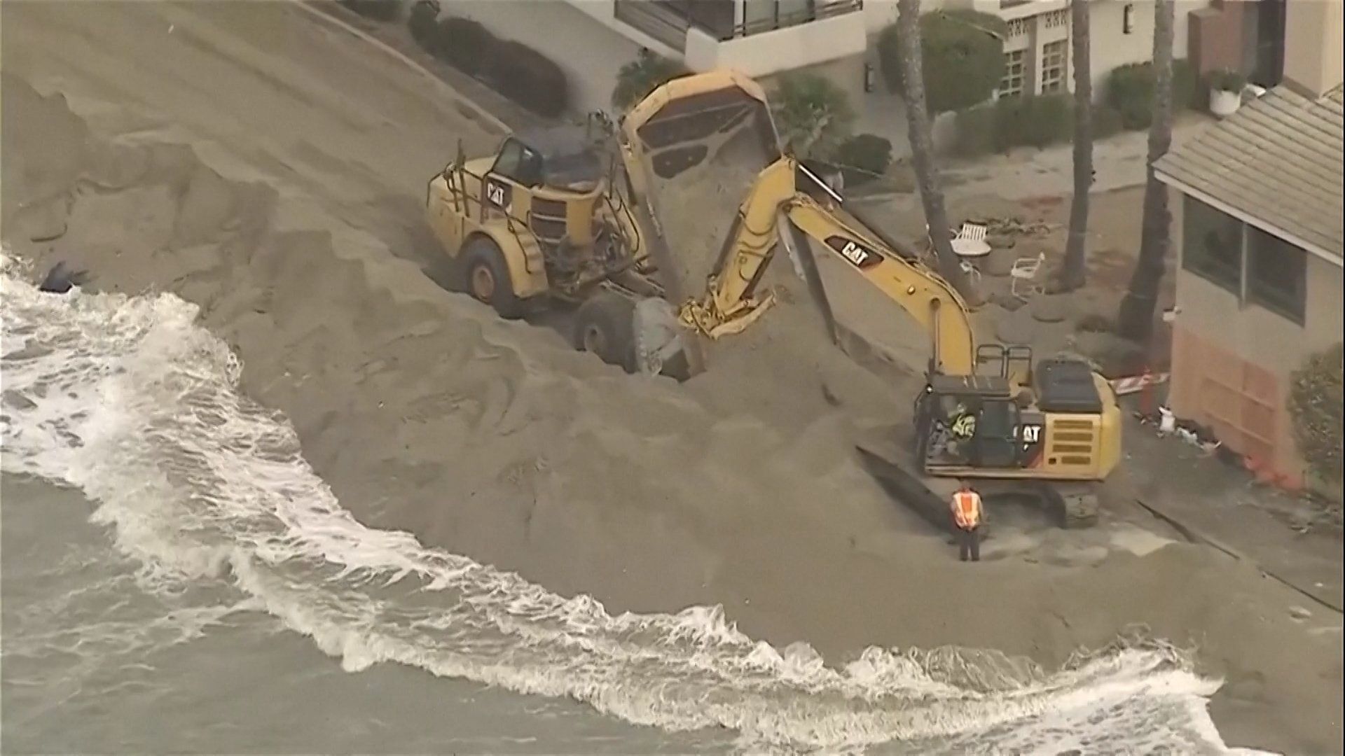 California coastal residents battle rising seas with emergency barriers