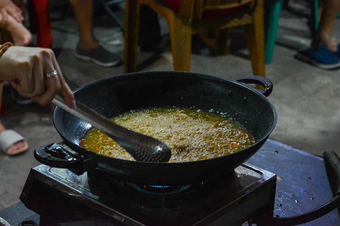 Taiwan prosecutes 15 people, four firms in tainted cooking oil case