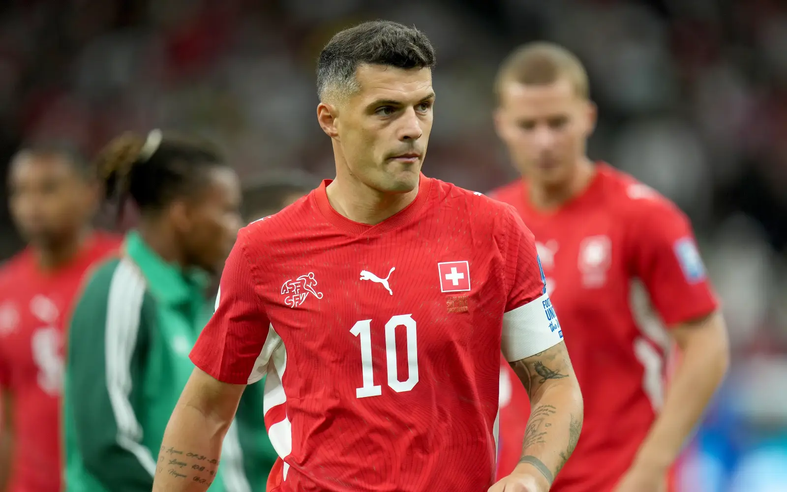 Swiss football stars cleared to return after document scandal
